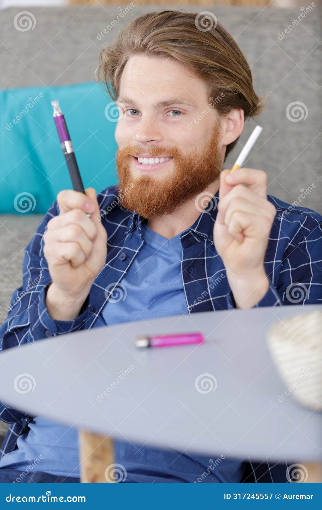 smiling man holding cigarette and vaper