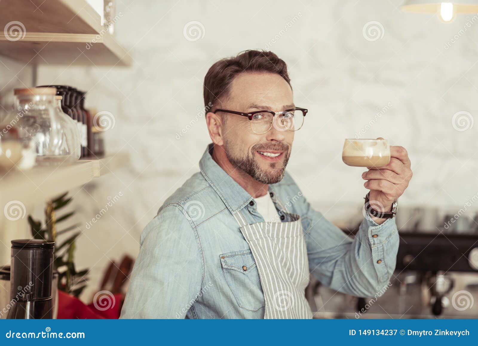 Smiling Man Holding Up His Cup of Coffee. Stock Image - Image of ...