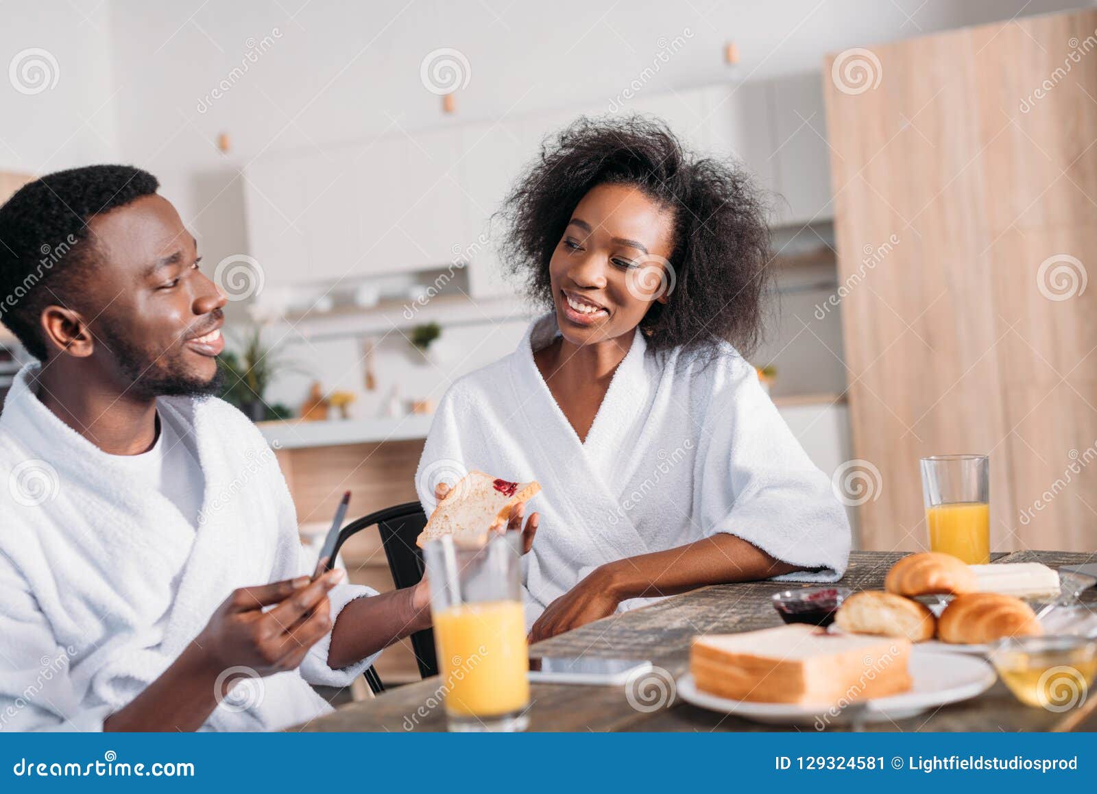 Smiling Man Spreading Jam on Toast and Girlfriend Stock Image Image