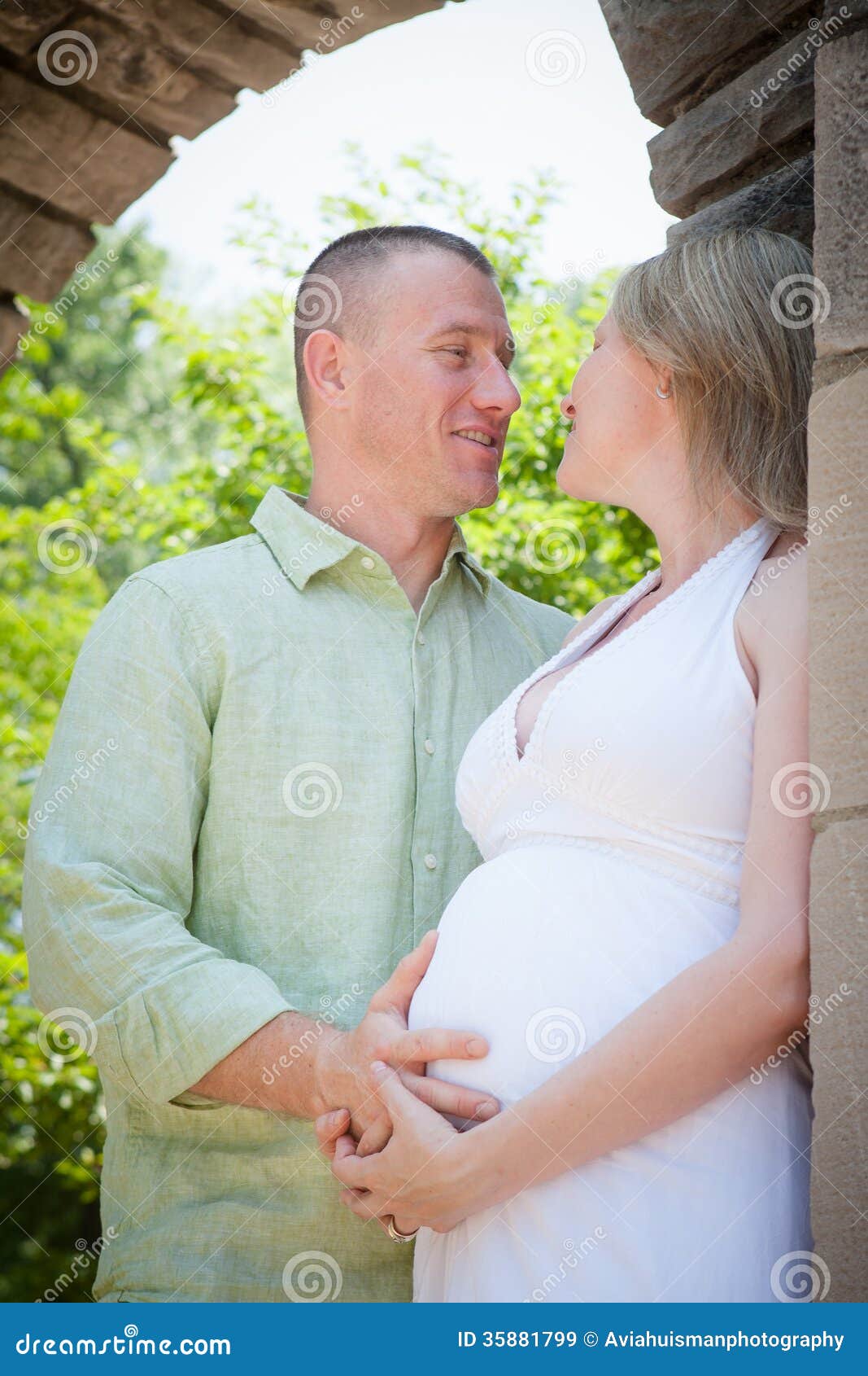 Smiling Man Touching His Wifes Pregnant Belly Royalty Free Stock Ima picture