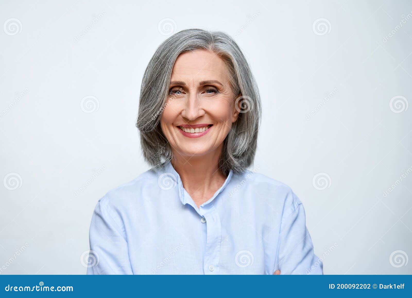 smiling mature business woman  on white background, headshot portrait.