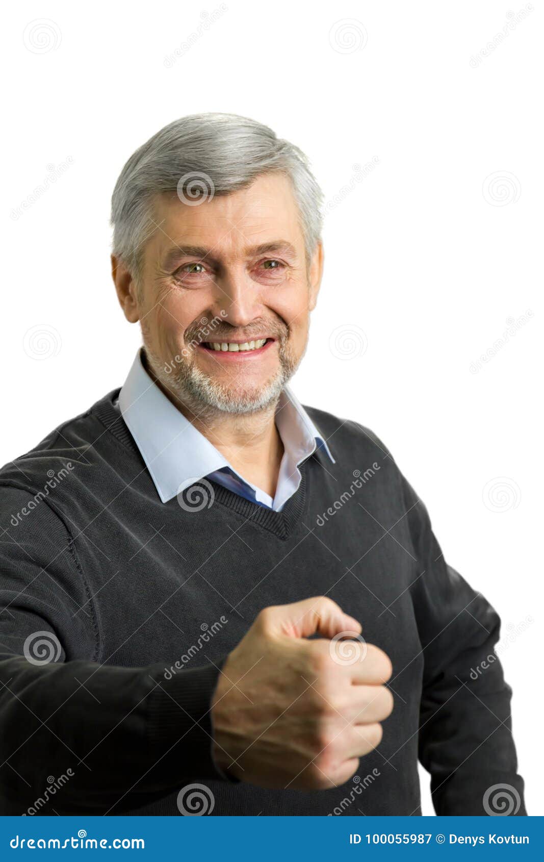smiling mature man clasped fist.