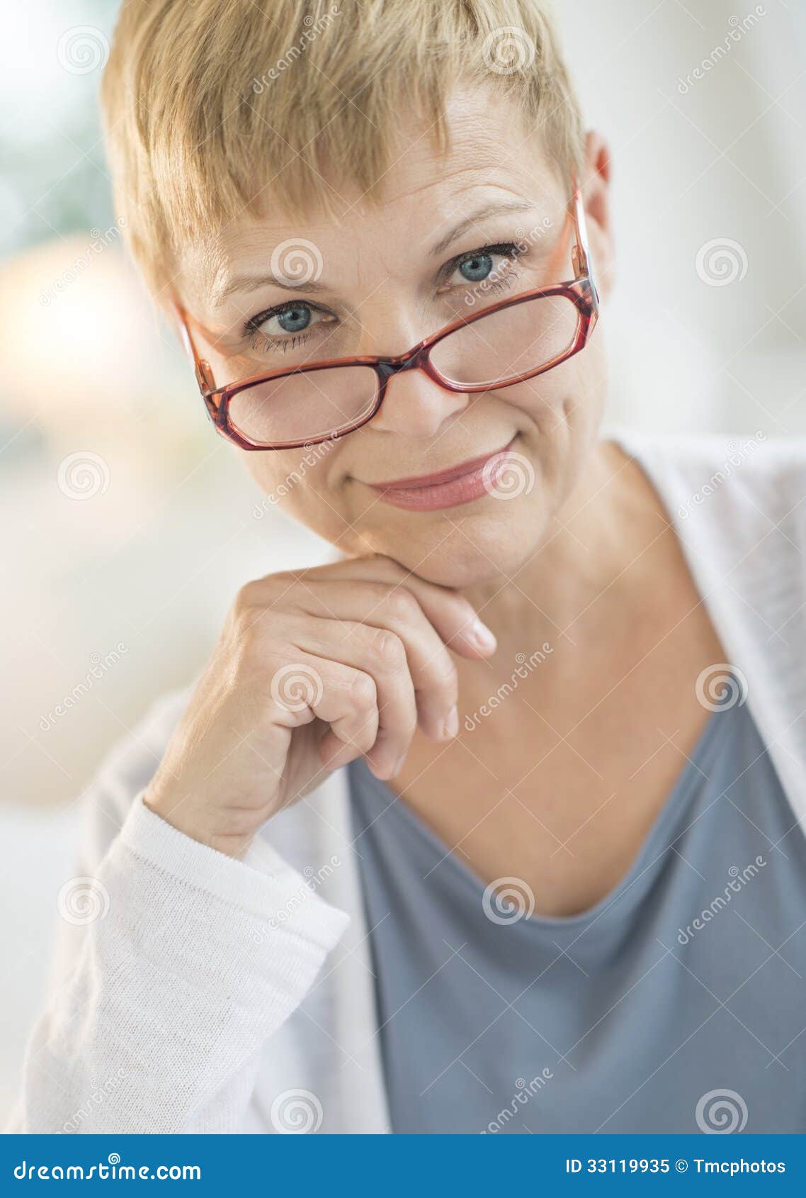Smiling Mature Woman Wearing Eyeglasses Stock Image
