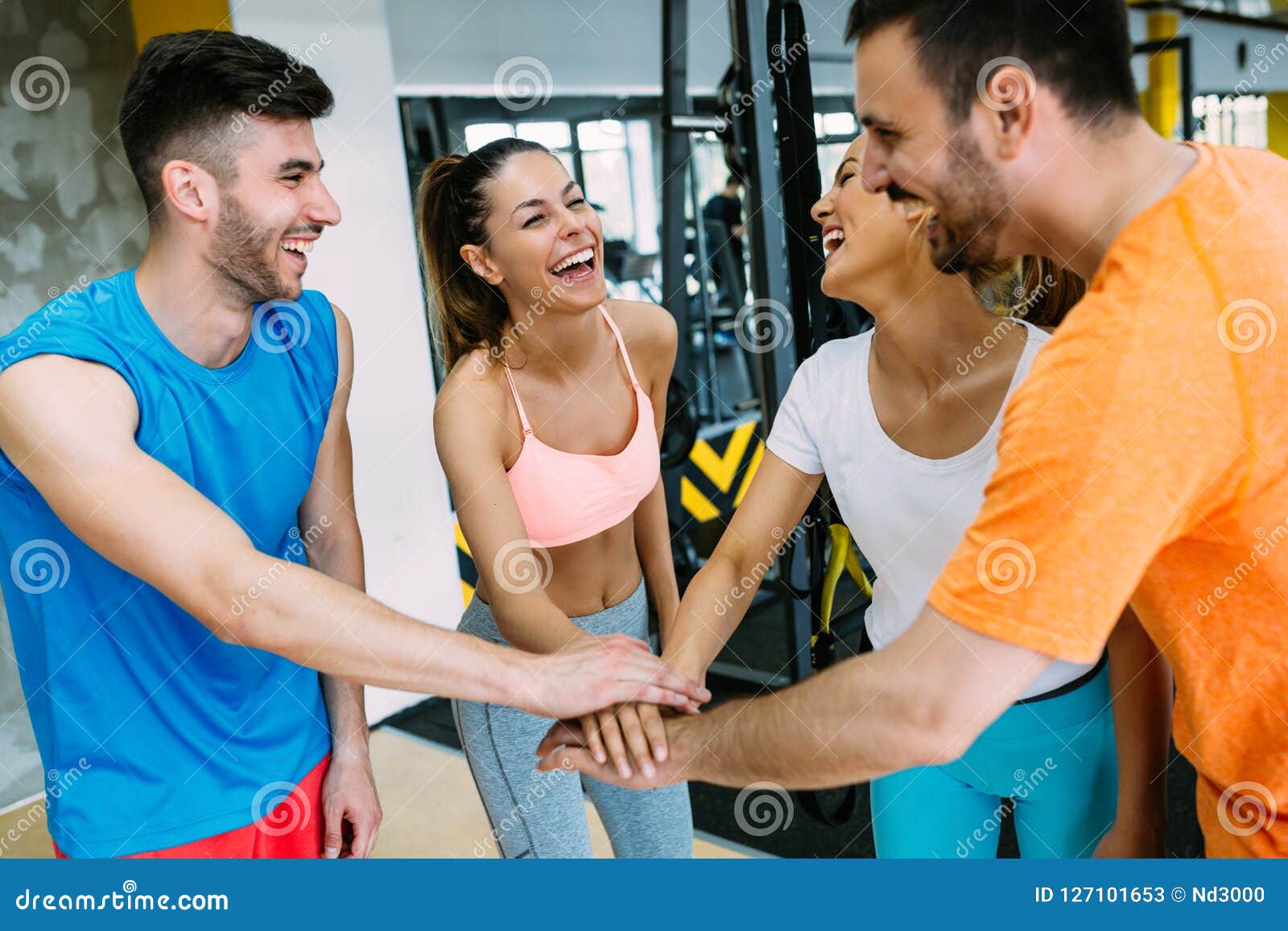 Smiling Men and Women Doing High Five in Gym Stock Image - Image of ...