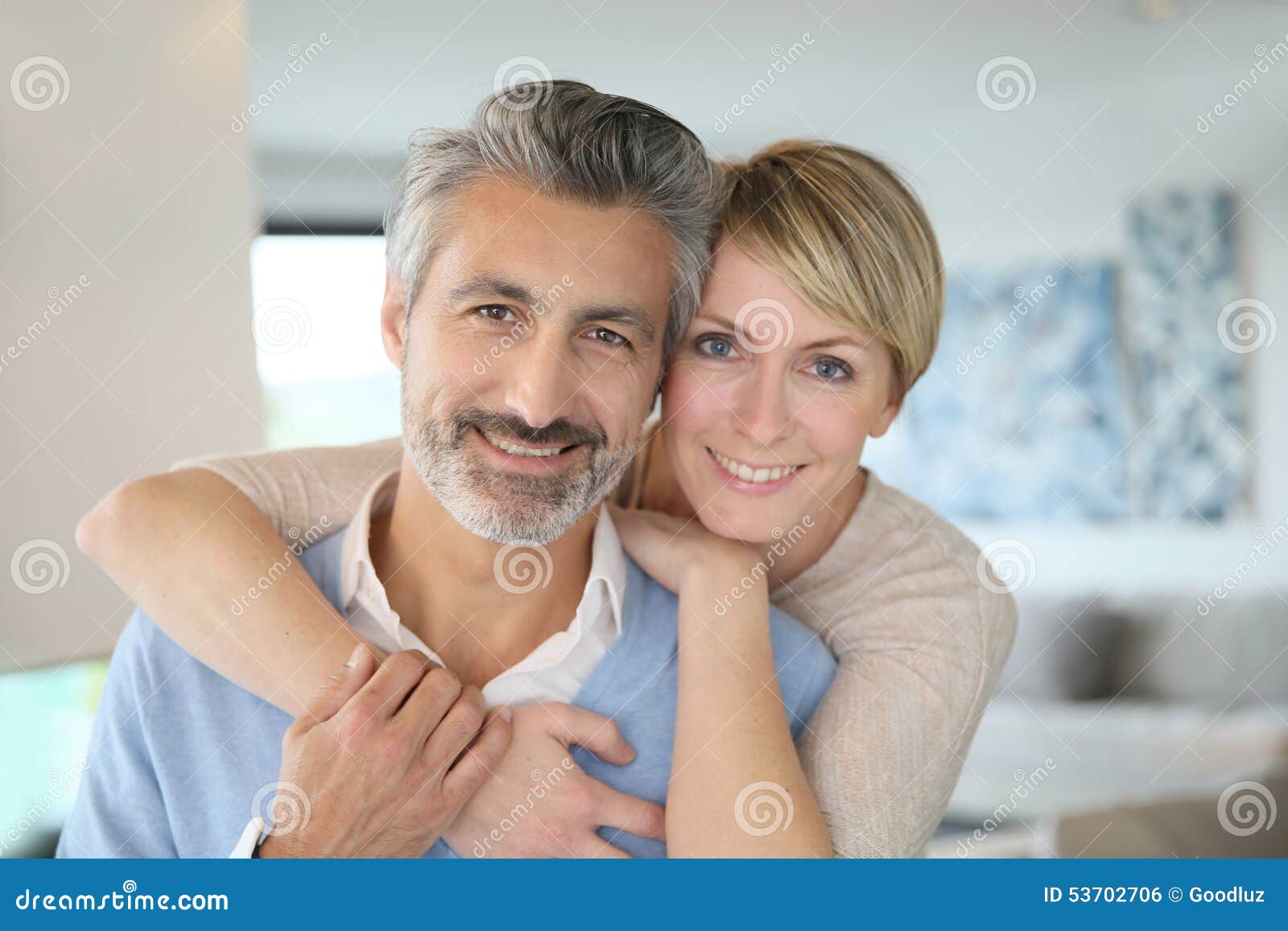 smiling middle-aged couple at home