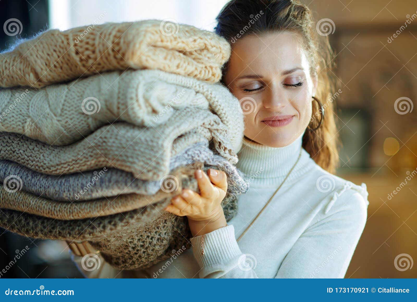 Smiling Modern 40 Years Old Housewife Holding Pile of Sweaters Stock ...