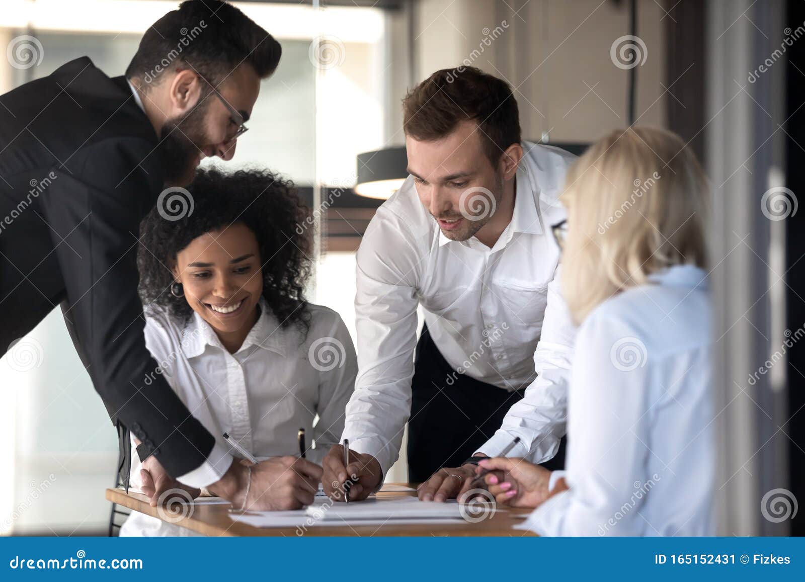 diverse colleagues brainstorm cooperating at meeting in office