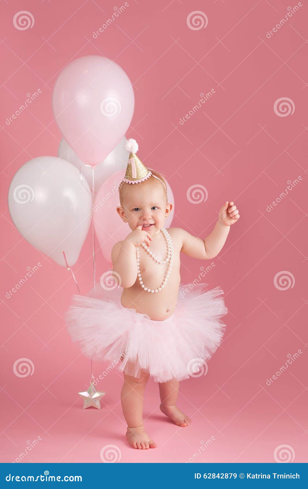 Smiling One Year Old Birthday Girl Wearing A Pink Tutu Stock Image