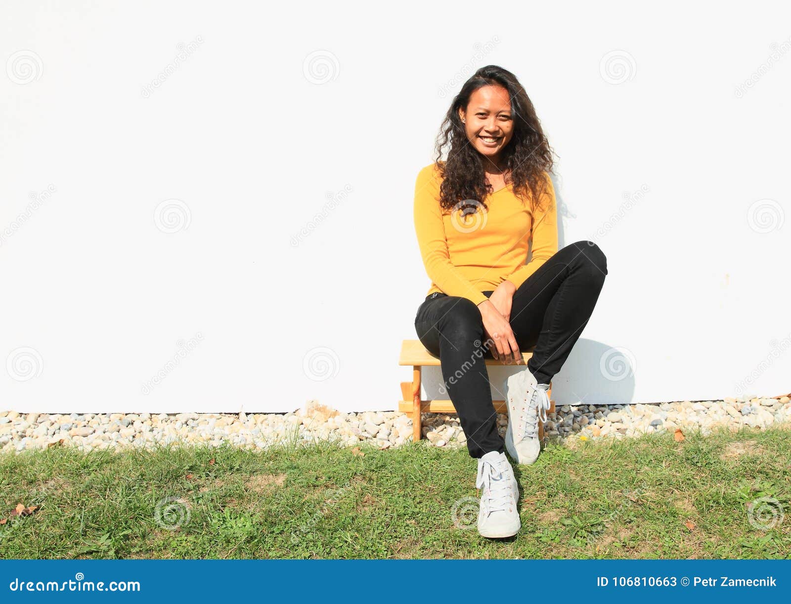 Smiling Pretty Girl Sitting on Wooden ...