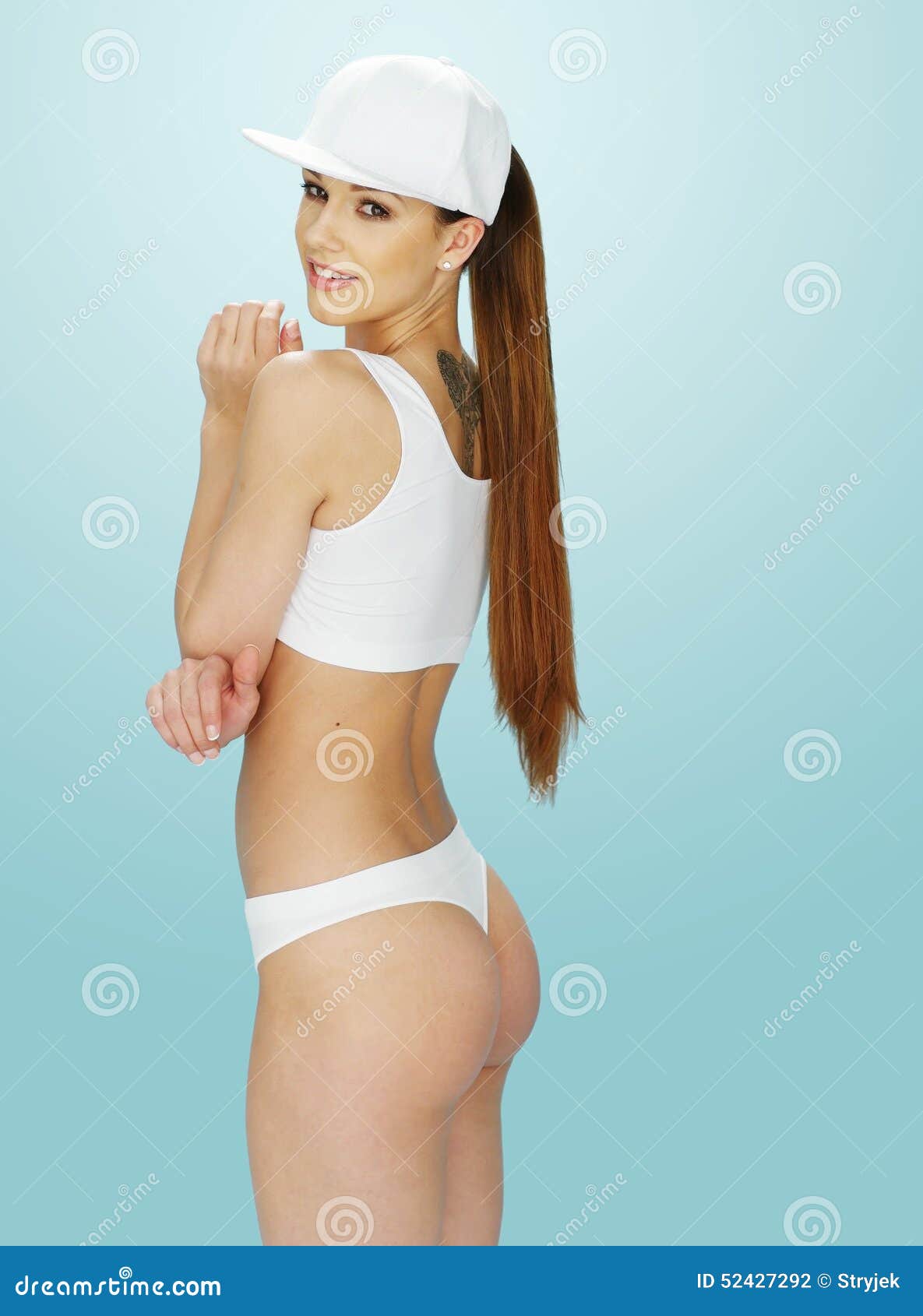 Attractive Young Woman In White Underwear Is Looking At Camera