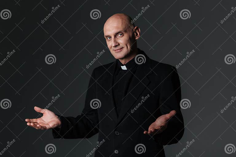 Smiling Priest Standing And Inviting You Stock Photo Image Of Bible