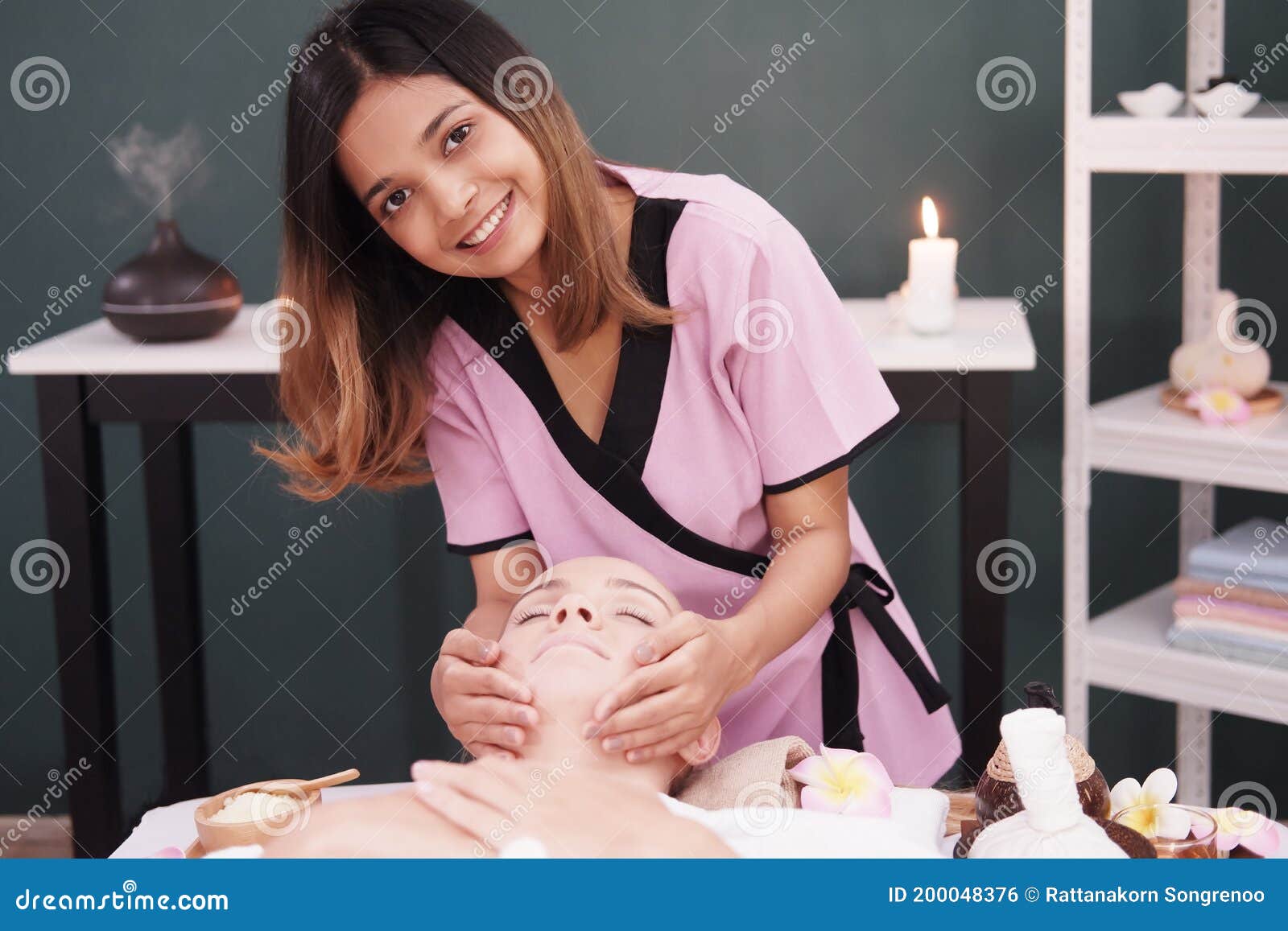 Smiling Professional Asian Thai Massage Therapist Woman Is Making Traditional Head And Facial