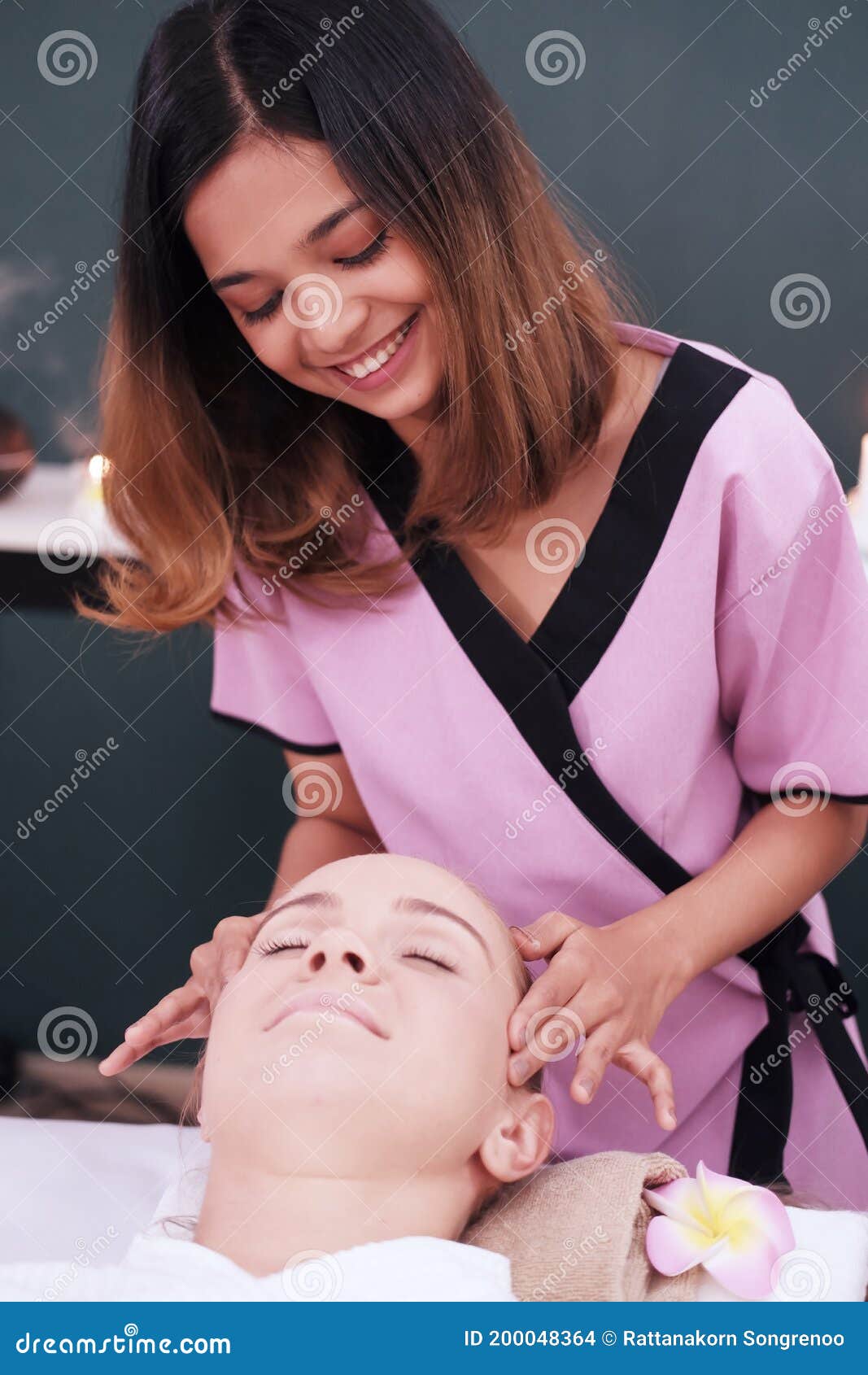 Smiling Professional Asian Thai Massage Therapist Woman Is Making Traditional Head And Facial