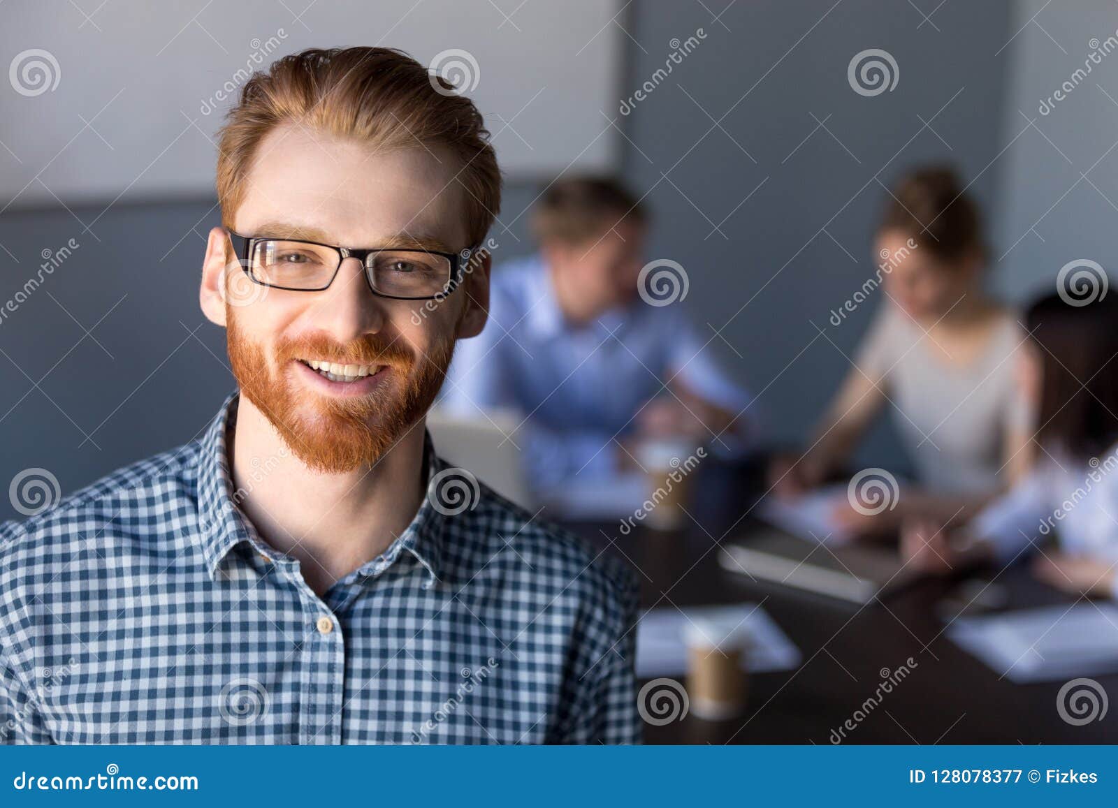 Smiling Red-haired Millennial Business Man in Glasses Looking at Stock ...