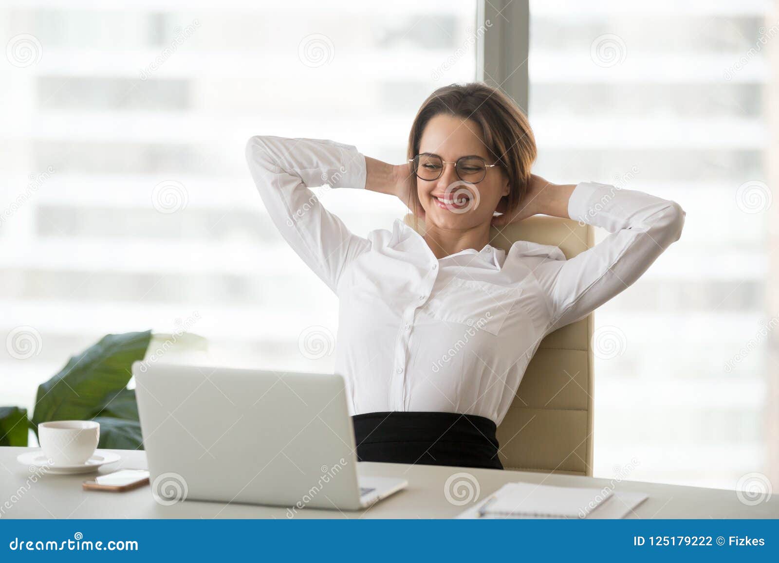 Smiling Relaxed Businesswoman Watching Funny Online Video at Wor Stock  Photo - Image of employee, goal: 125179222