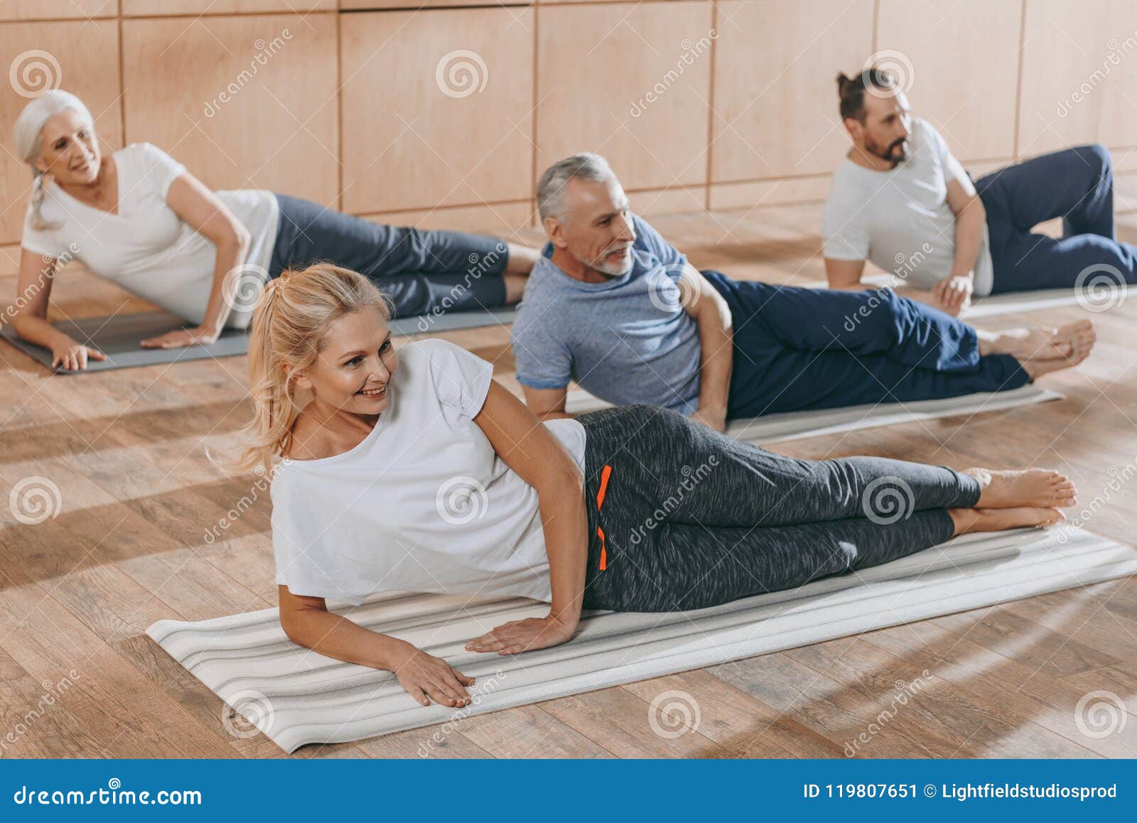 Smiling Senior People Training on Yoga Mats Stock Image Image of