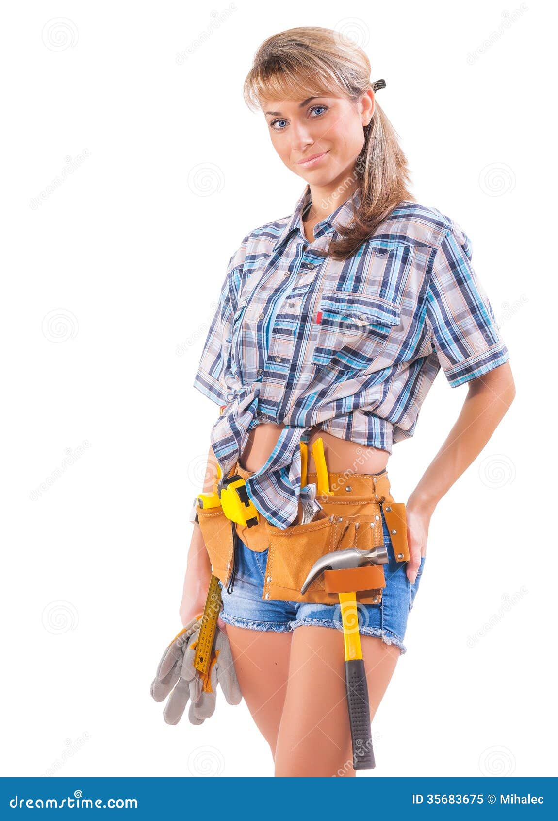 Smiling young female construction worker isolated on white. Beautiful female worker wearing working wear isolated on white background