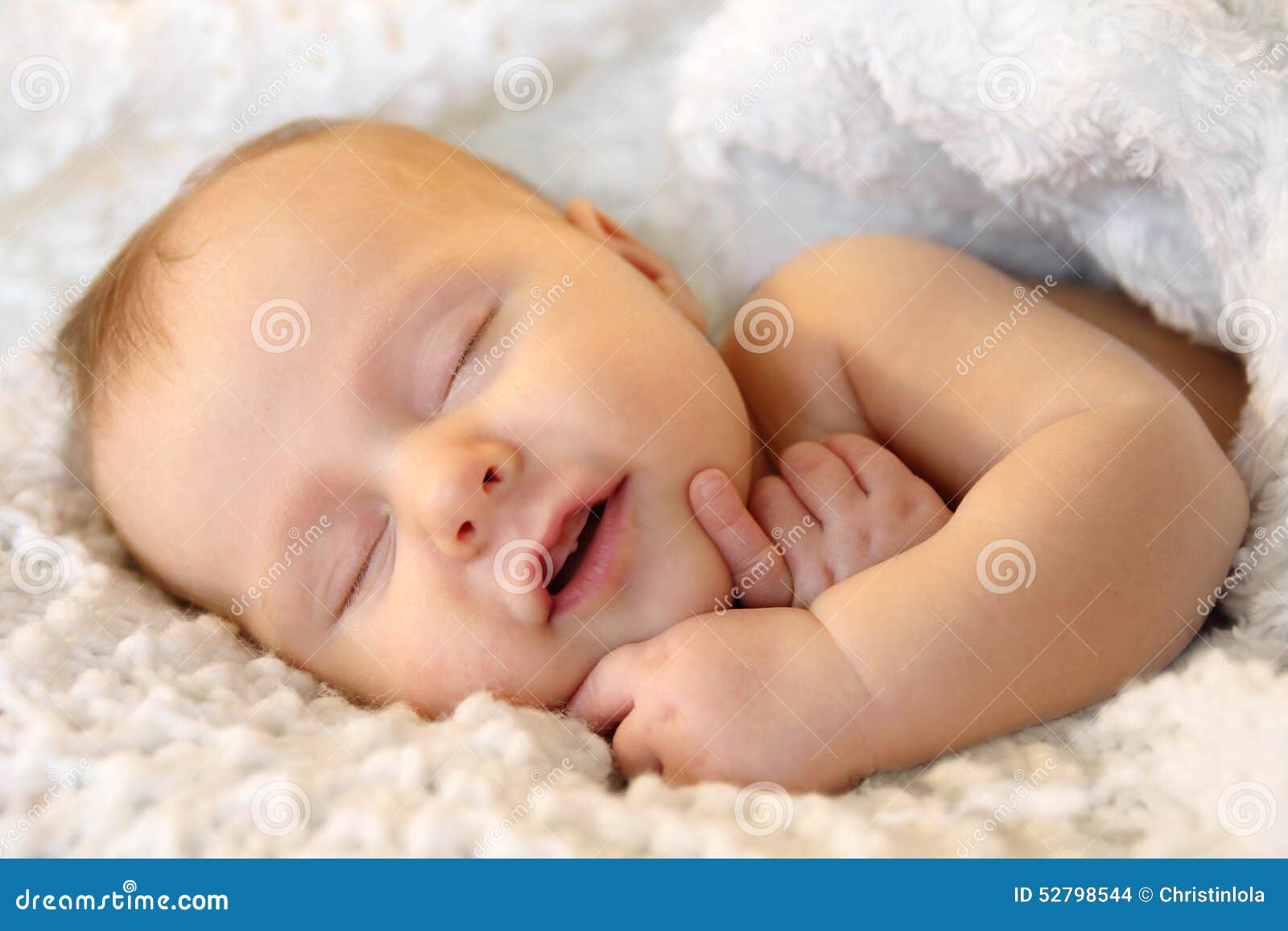 Smiling Sleeping Newborn Baby Girl Wrapped in White Blanket Stock ...