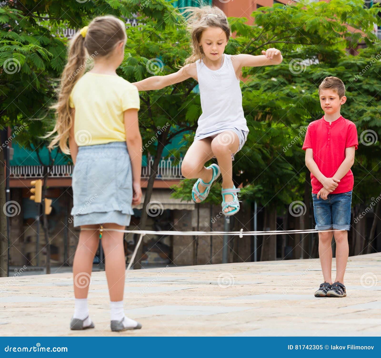 Smiling Small Kids Playing with Jumping Rope Stock Image - Image of