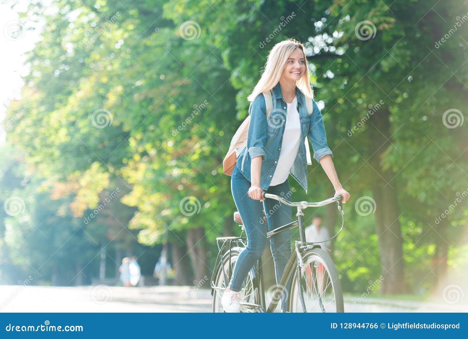 Smiling Student with Backpack Riding Bicycle Stock Photo Image of