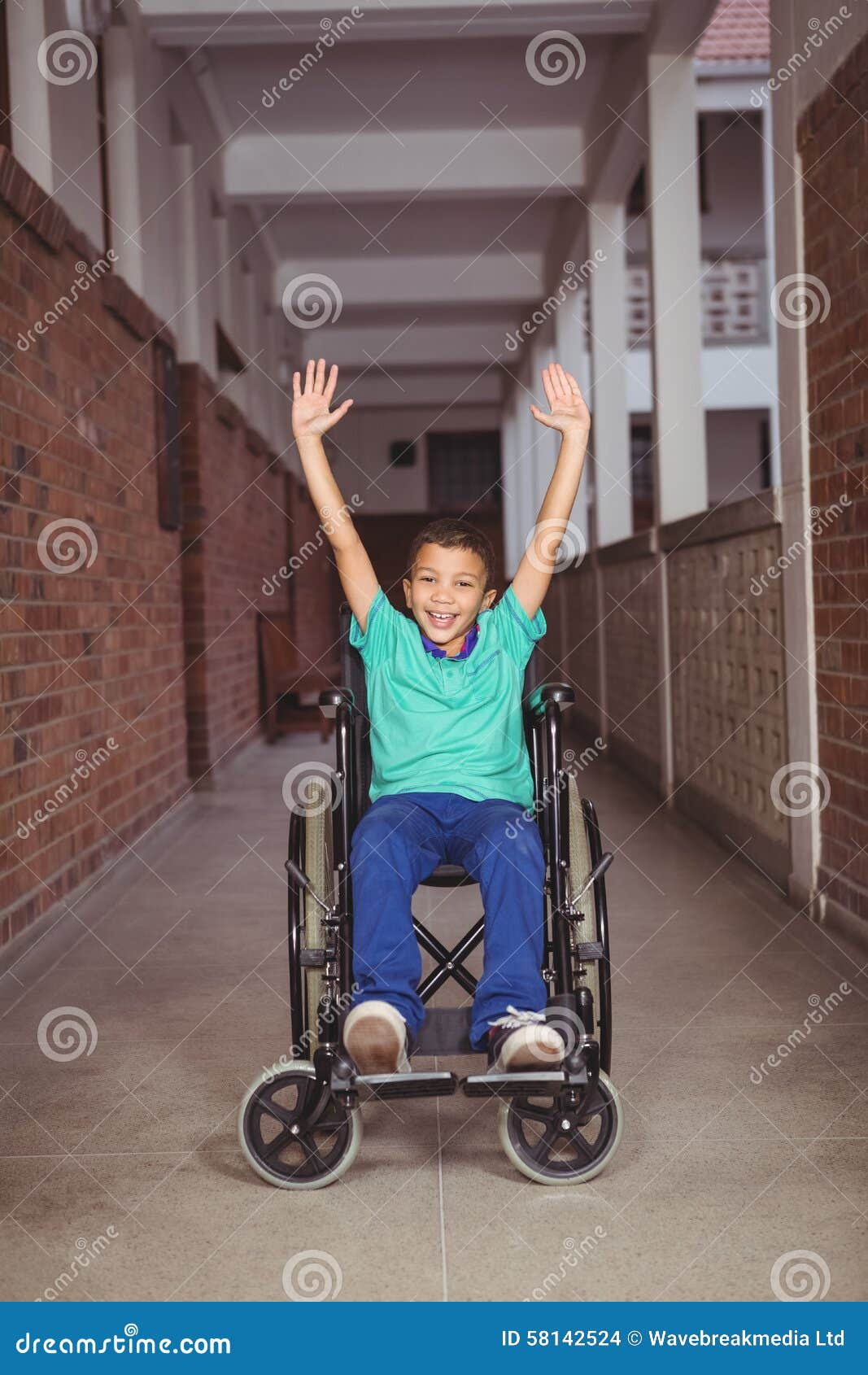 Smiling Student in a Wheelchair with Arms Raised Stock Photo Image of