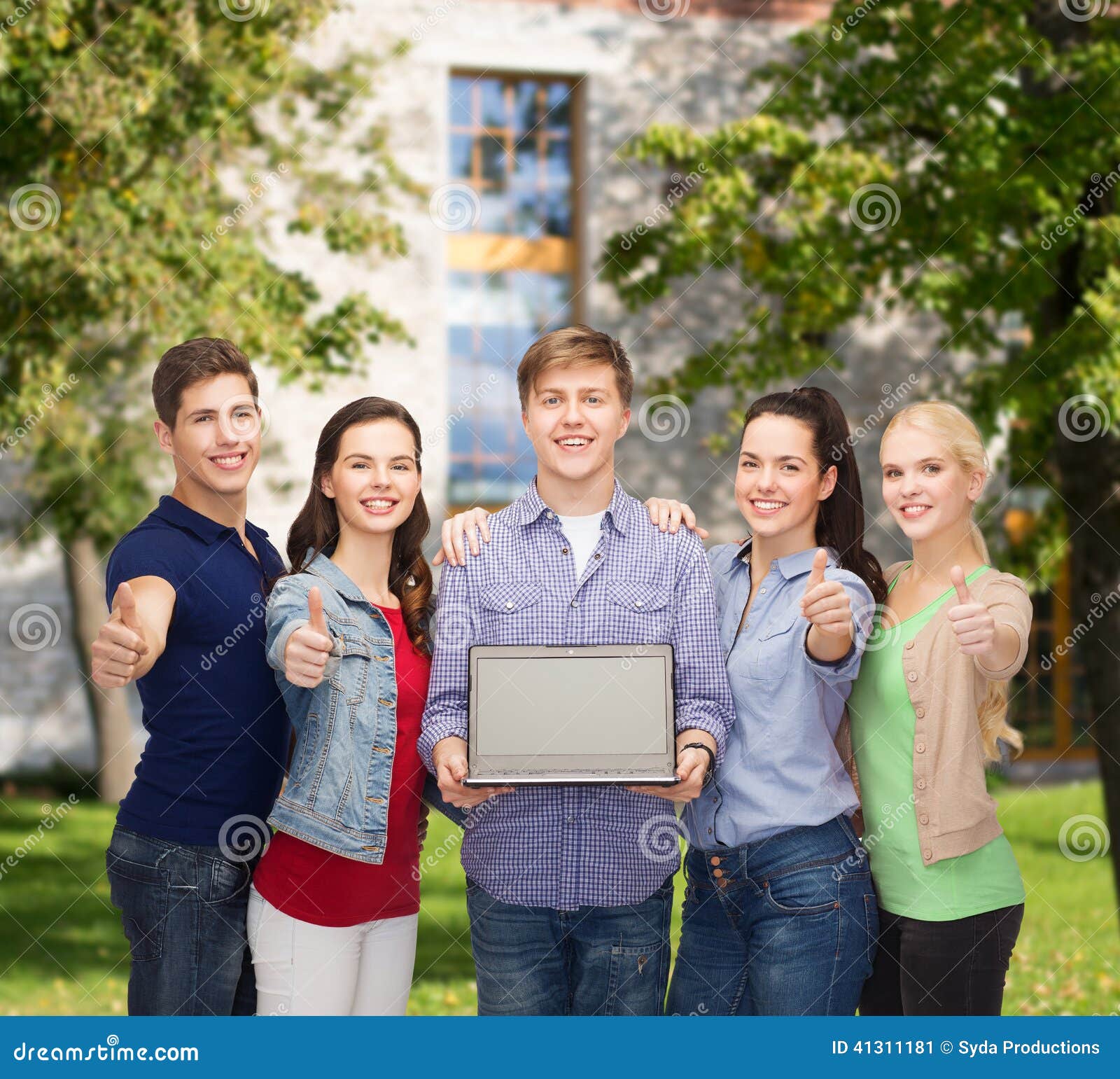 Smiling Students With Laptop Computer Stock Image - Image of many
