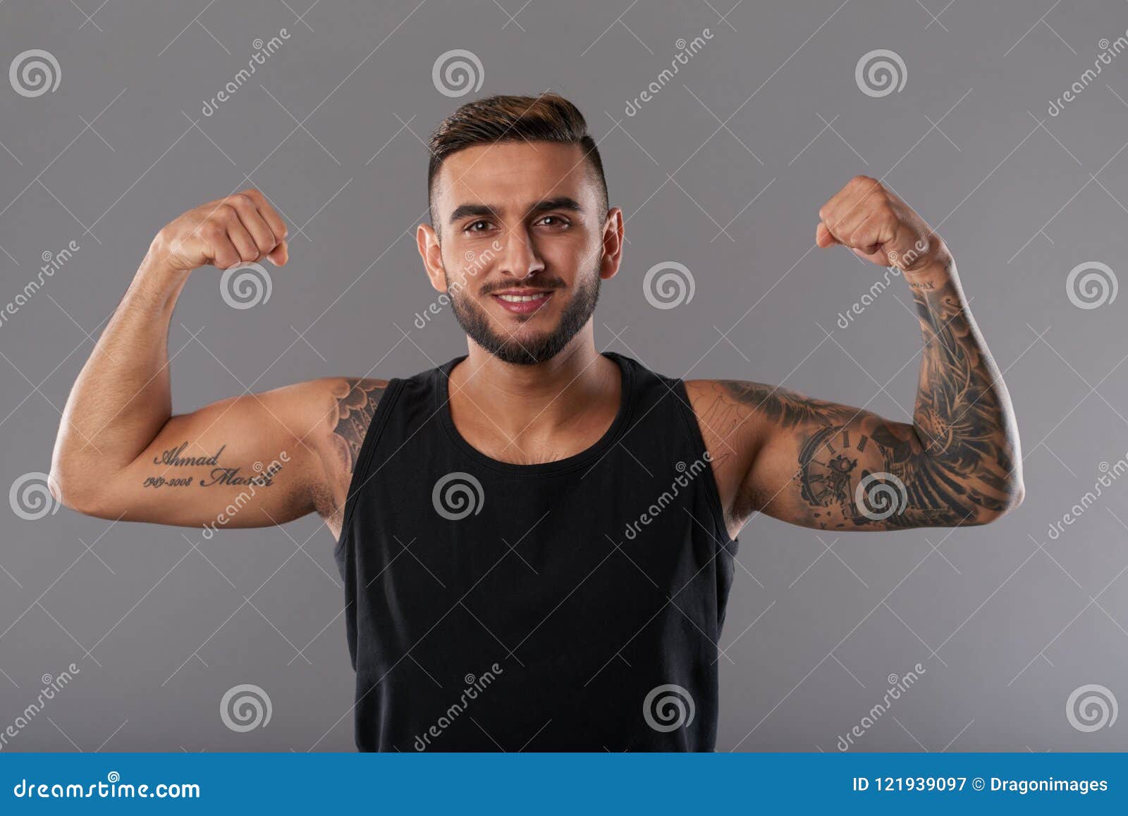 Shirtless Man With Tattoo on Body Flexing His Biceps · Free Stock Photo