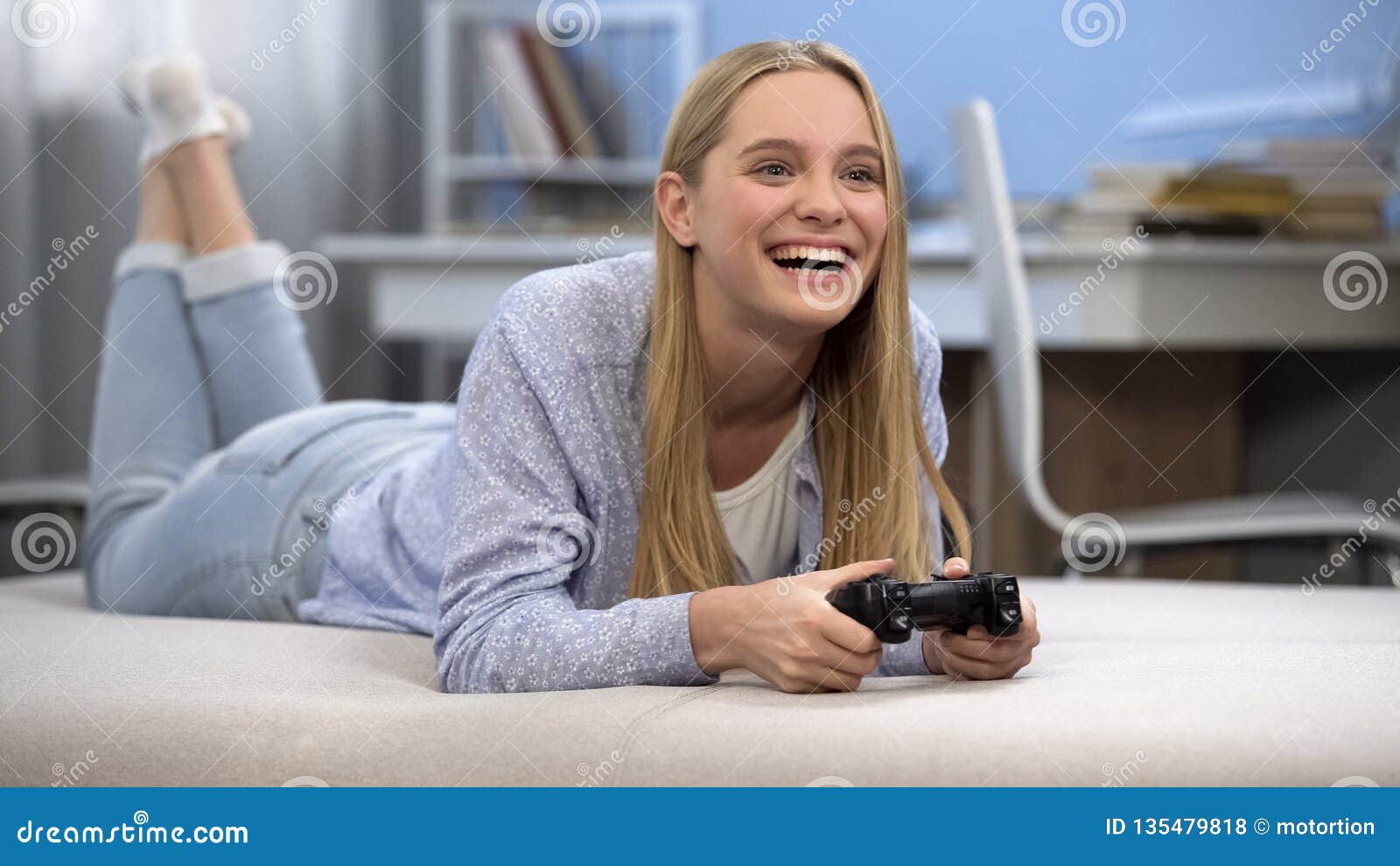 Smiling Teen Girl Gamer Playing Game With Joystic