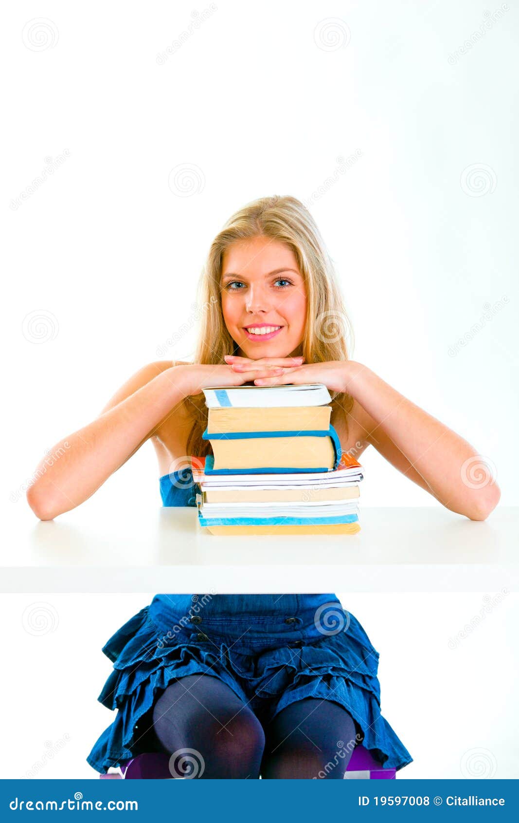 Smiling Teen Girl Holding Hands On Piles Of Books Stock