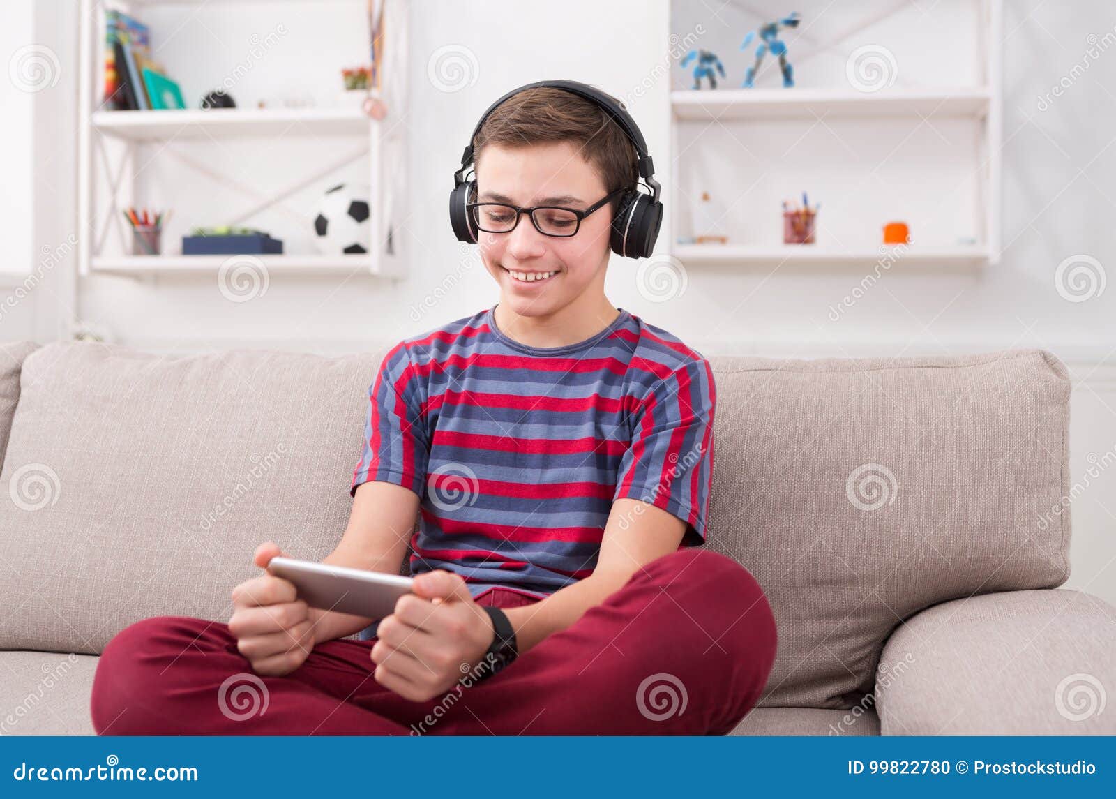 Teenager Boy Online Plays A Computer Game With Headphones And A