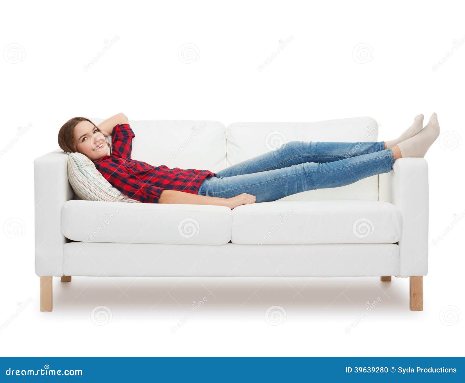 Smiling Teenage Girl Lying On Sofa Royalty Free Stock Image