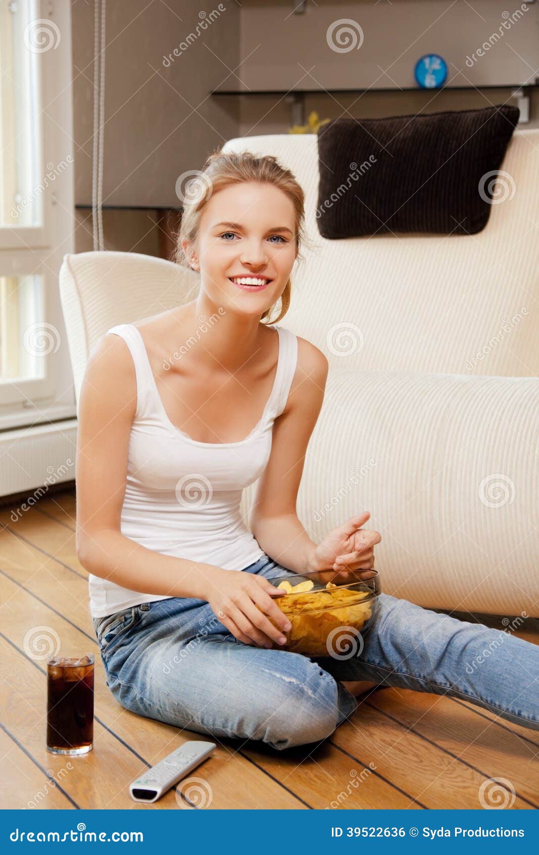 Smiling Teenage Girl With Remote
