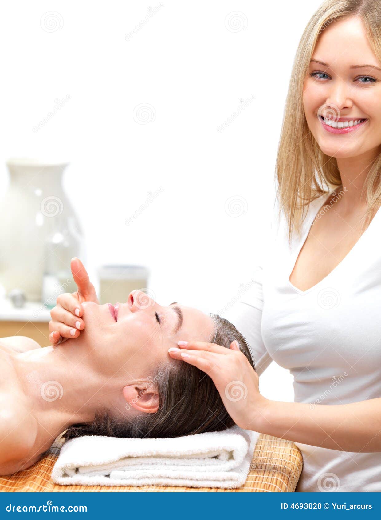 Smiling Therapist Giving Senior Woman A Massage Stock