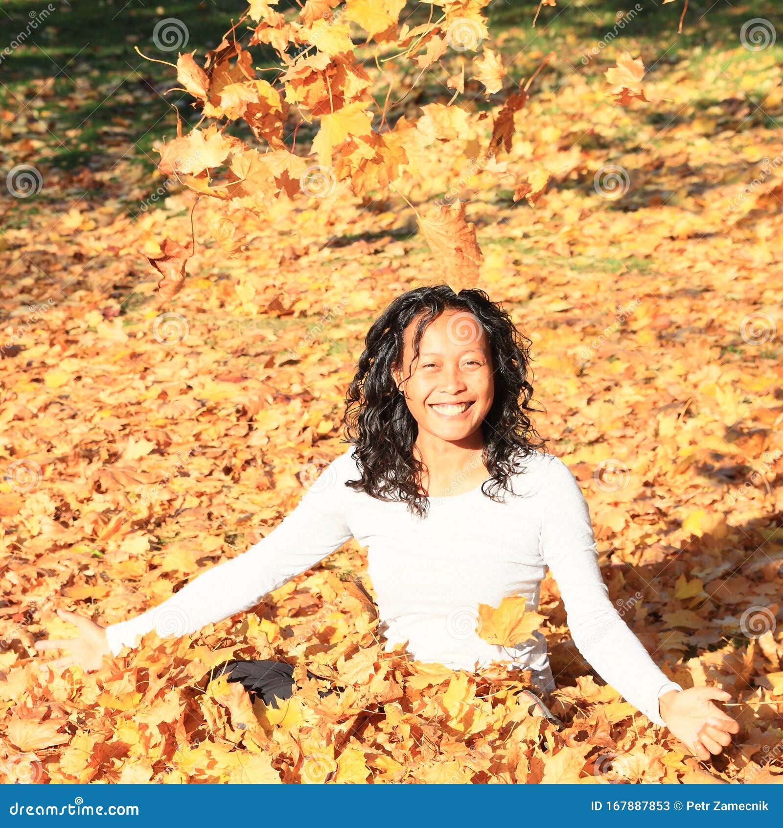 Smiling Tropical Girl Under Falling Yellow Leaves Stock Image - Image ...
