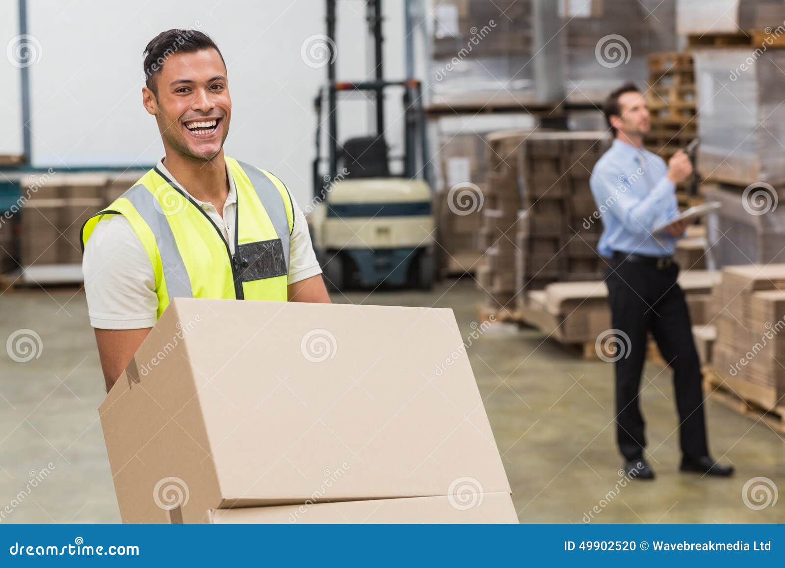 Smiling Warehouse Worker Moving Boxes on Trolley Stock Photo Image of occupation, distribution