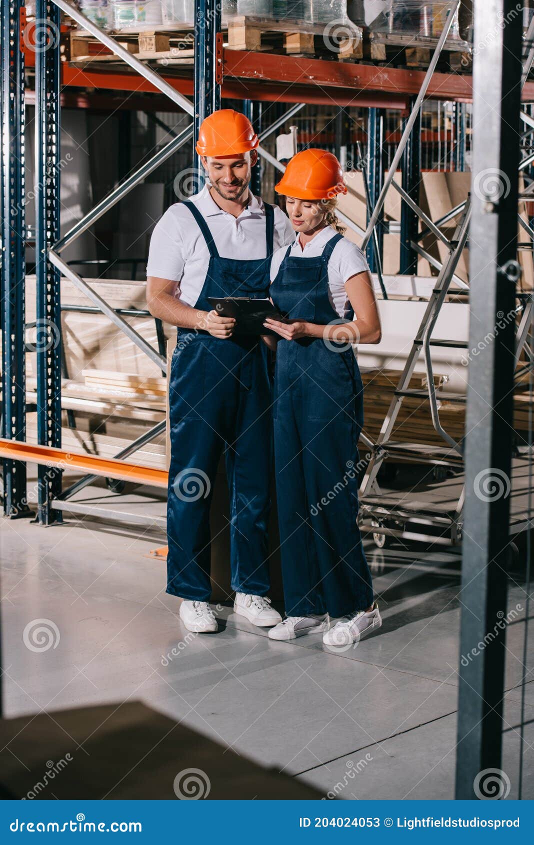 Smiling Warehouse Workers in Overalls Stock Image Image of workman, workwoman 204024053