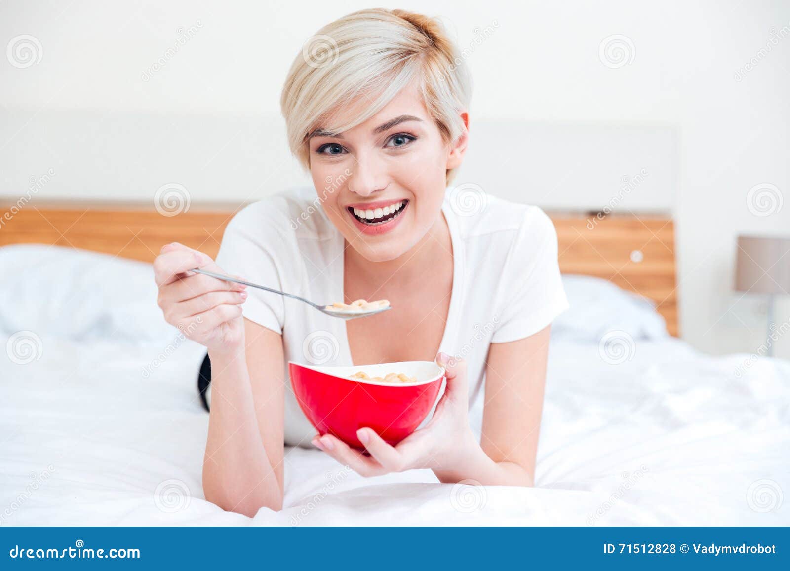 Smiling Woman Eating Cereal on the Bed Stock Photo Image of beautiful