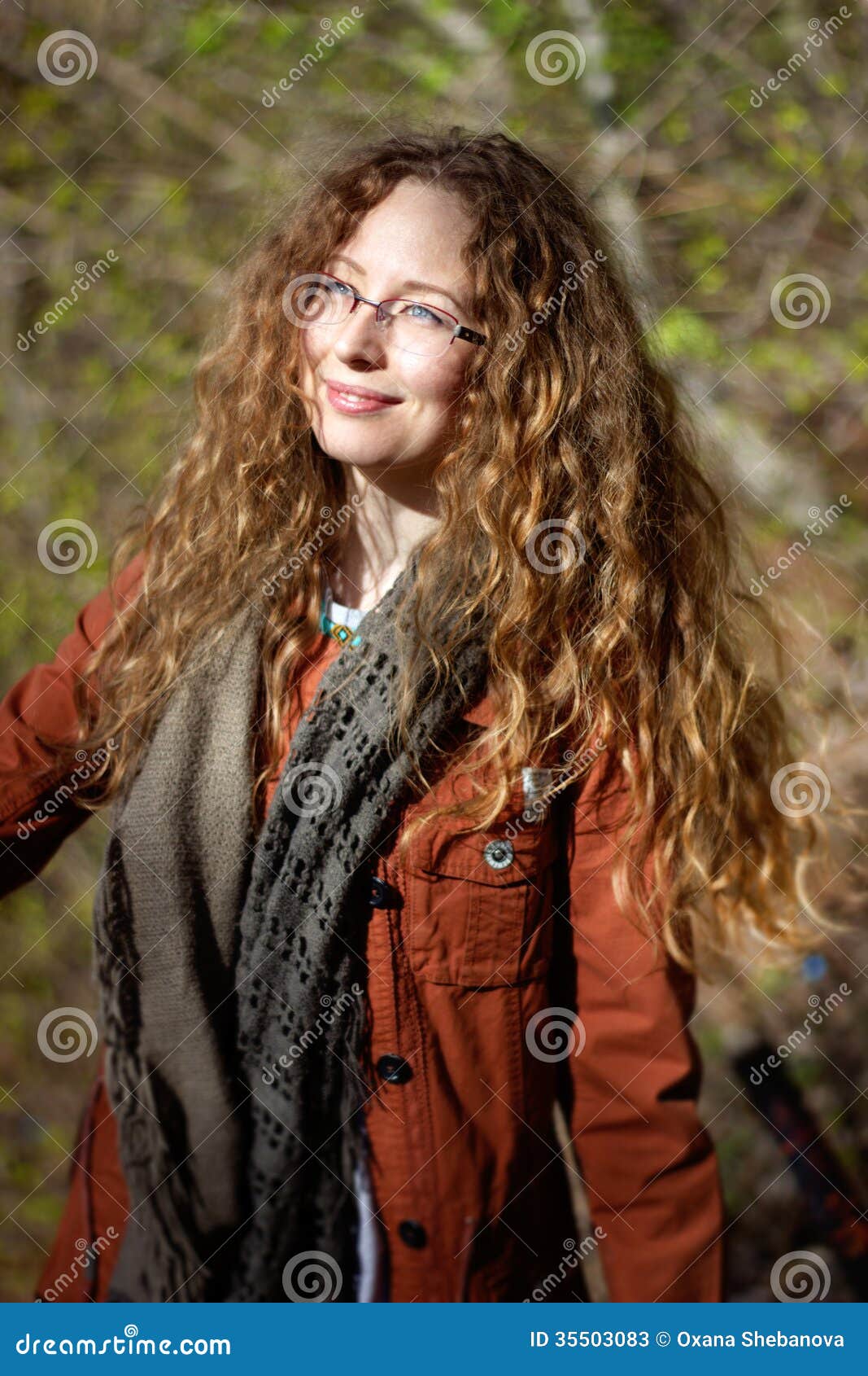Smiling Woman With Glasses And Blonde Curly Hair On Sunny
