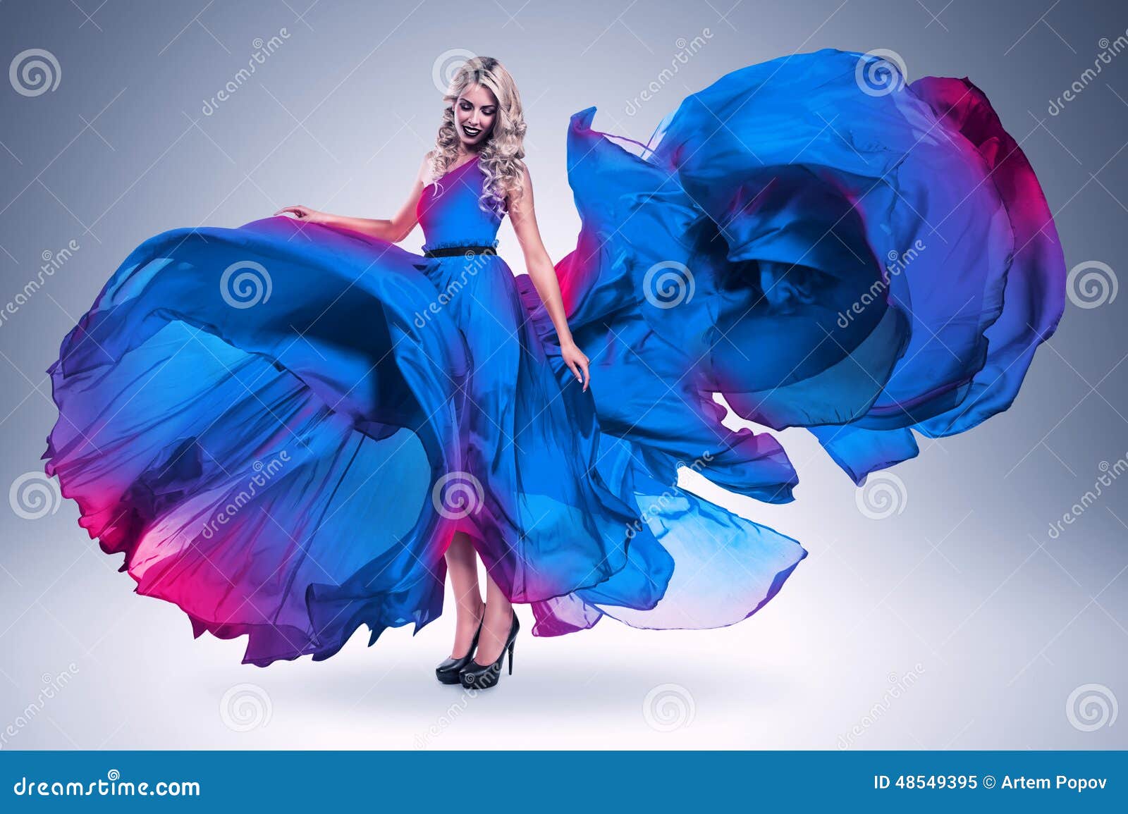 Smiling Woman in Large Flying Blue Dress Stock Image - Image of heels ...