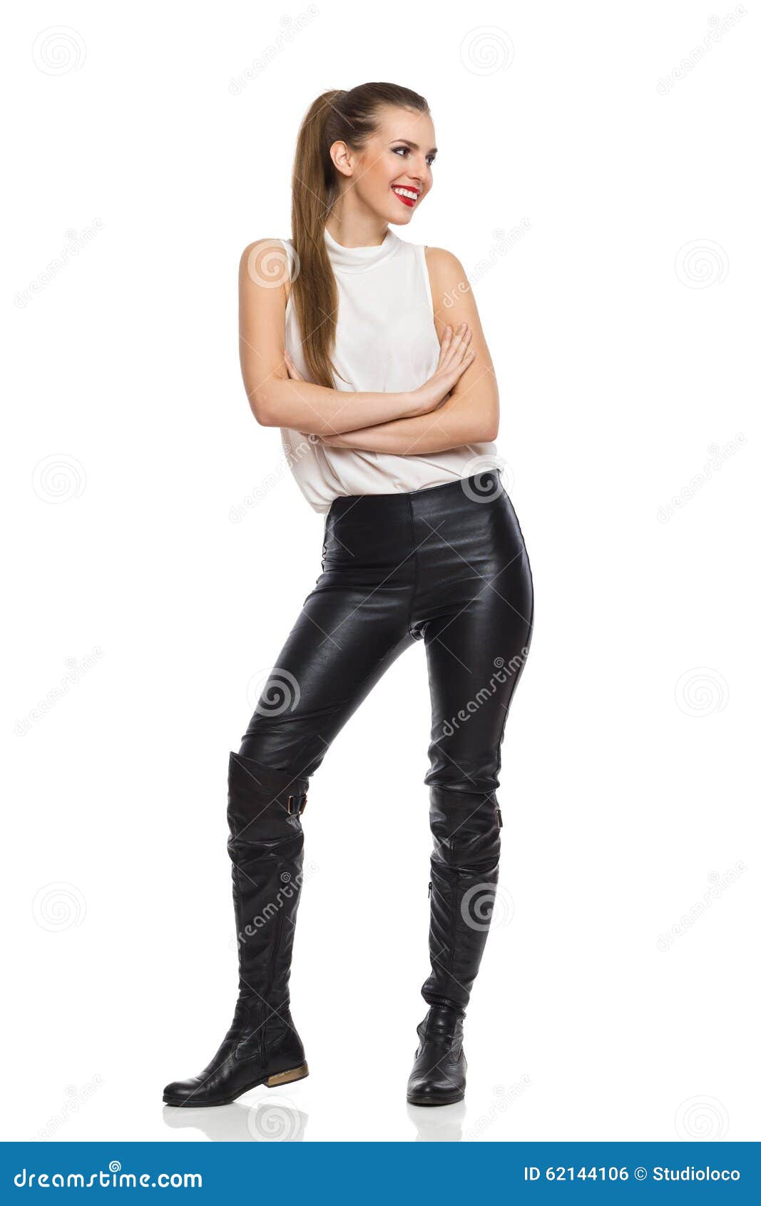 Smiling Woman in Leather Trousers Looking Away Stock Photo - Image of ...