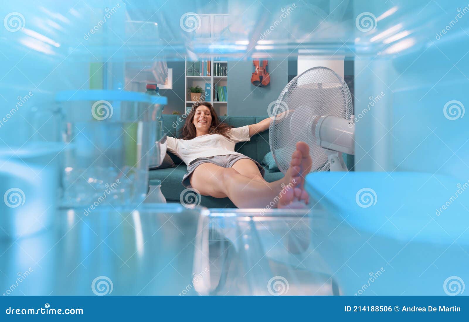 woman keeping herself cool at home in the summer