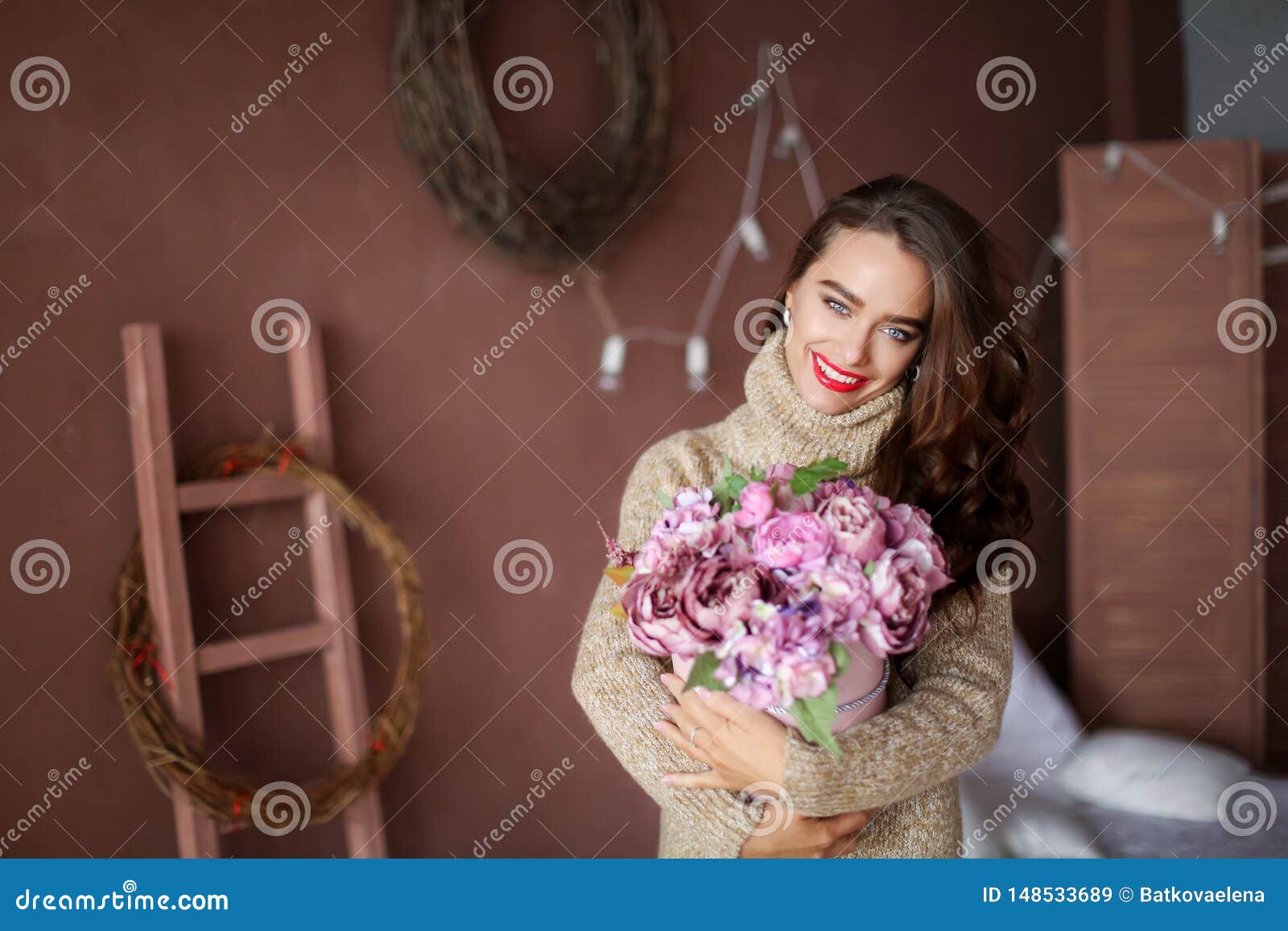 Smiling Woman in Pajama Holding Gift Box and Looking at the Camera ...