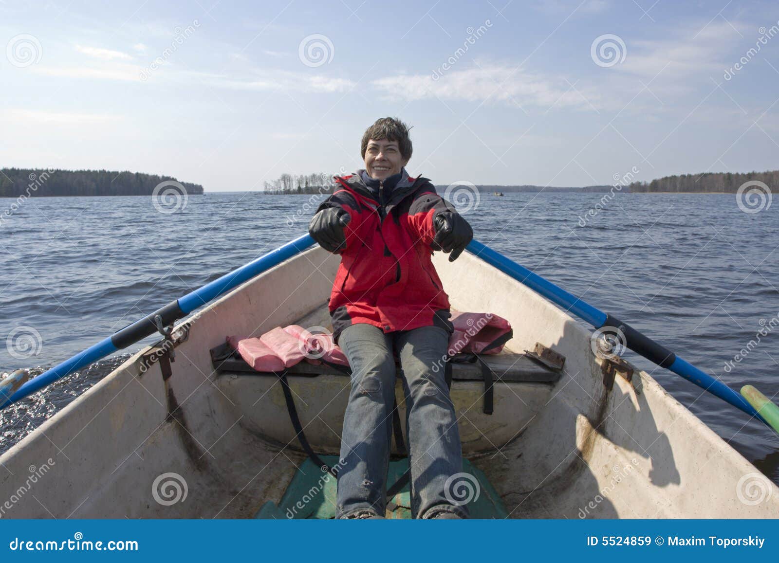 Smiling Woman Rowing On Boat Royalty Free Stock Images 