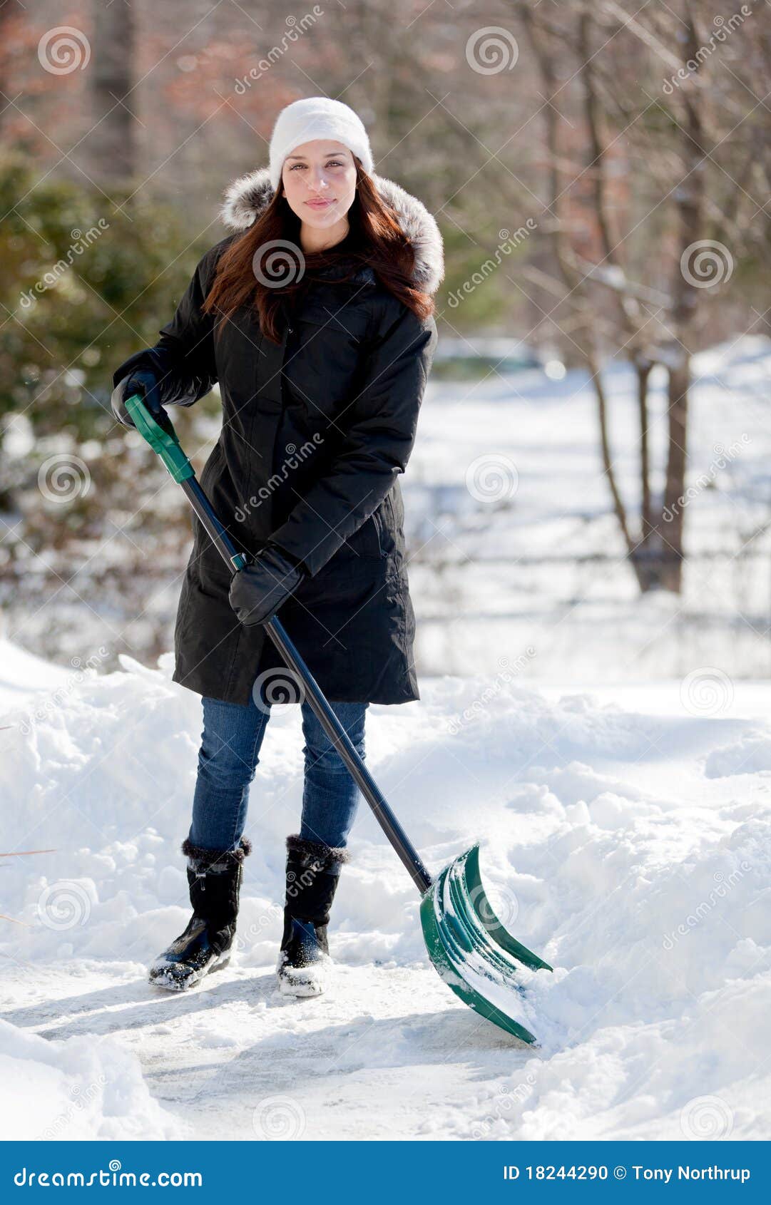 smiling-woman-shoveling-snow-18244290.jpg