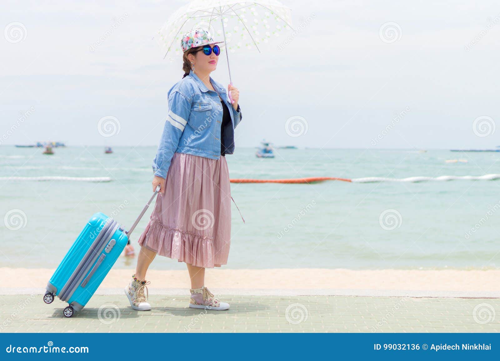 Smiling Women is Holding Umbrella and Pulling Modern Blue Rolling Hard