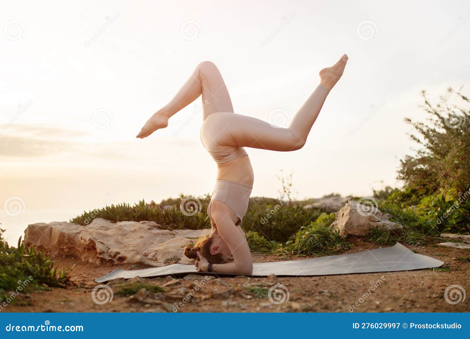 Smiling Young Caucasian Lady in Sportswear Practicing Yoga on Head on Ocean  Beach at Sunrise, Full Length, Sun Flare Stock Image - Image of fitness,  millennial: 276029997