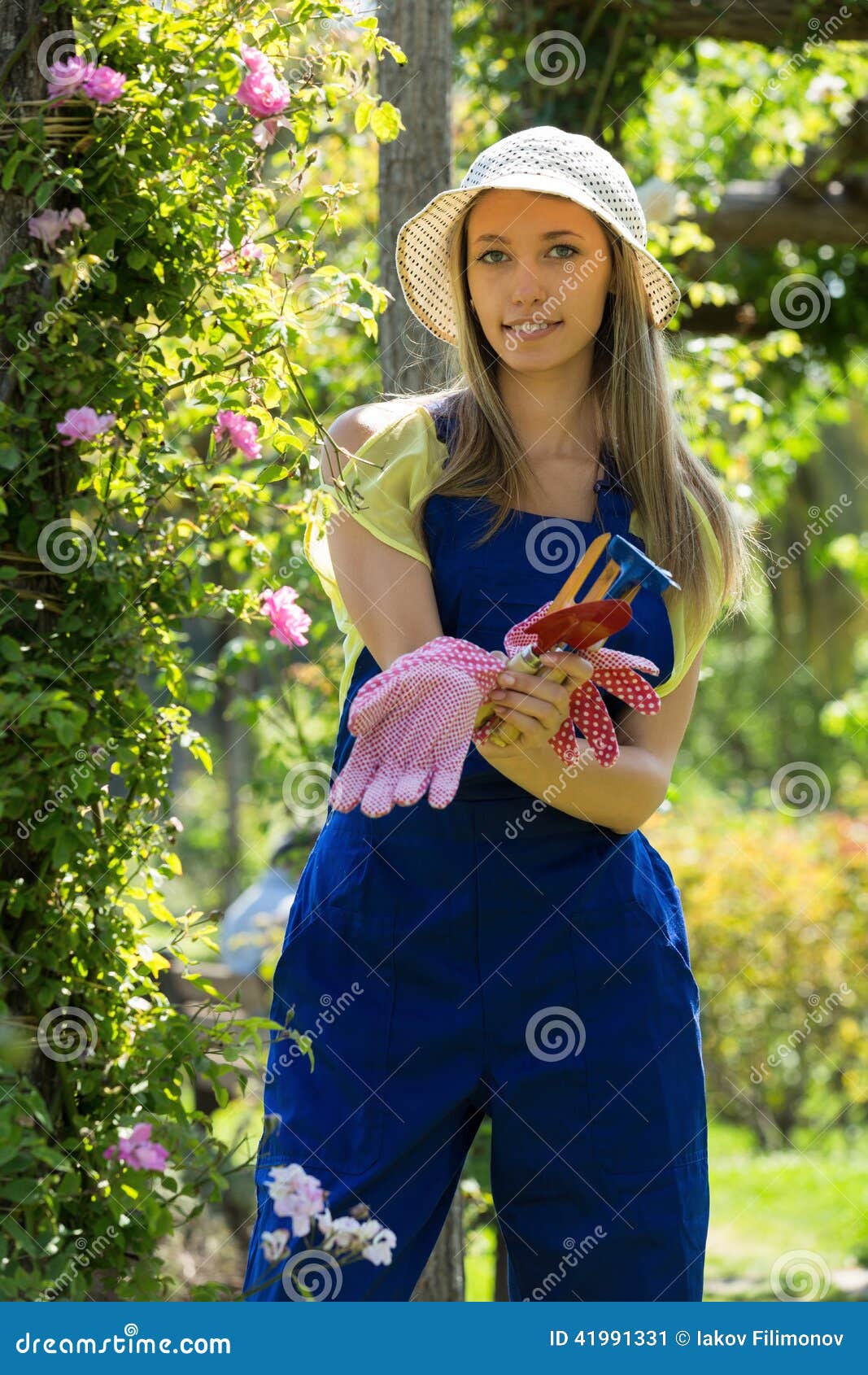 Smiling Young Female in Uniform Working with Roses Stock Image Image