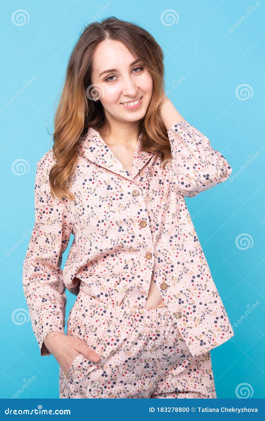 Smiling Young Girl In Pajamas Home Wear Posing While Resting At Home Isolated On Blue Background 