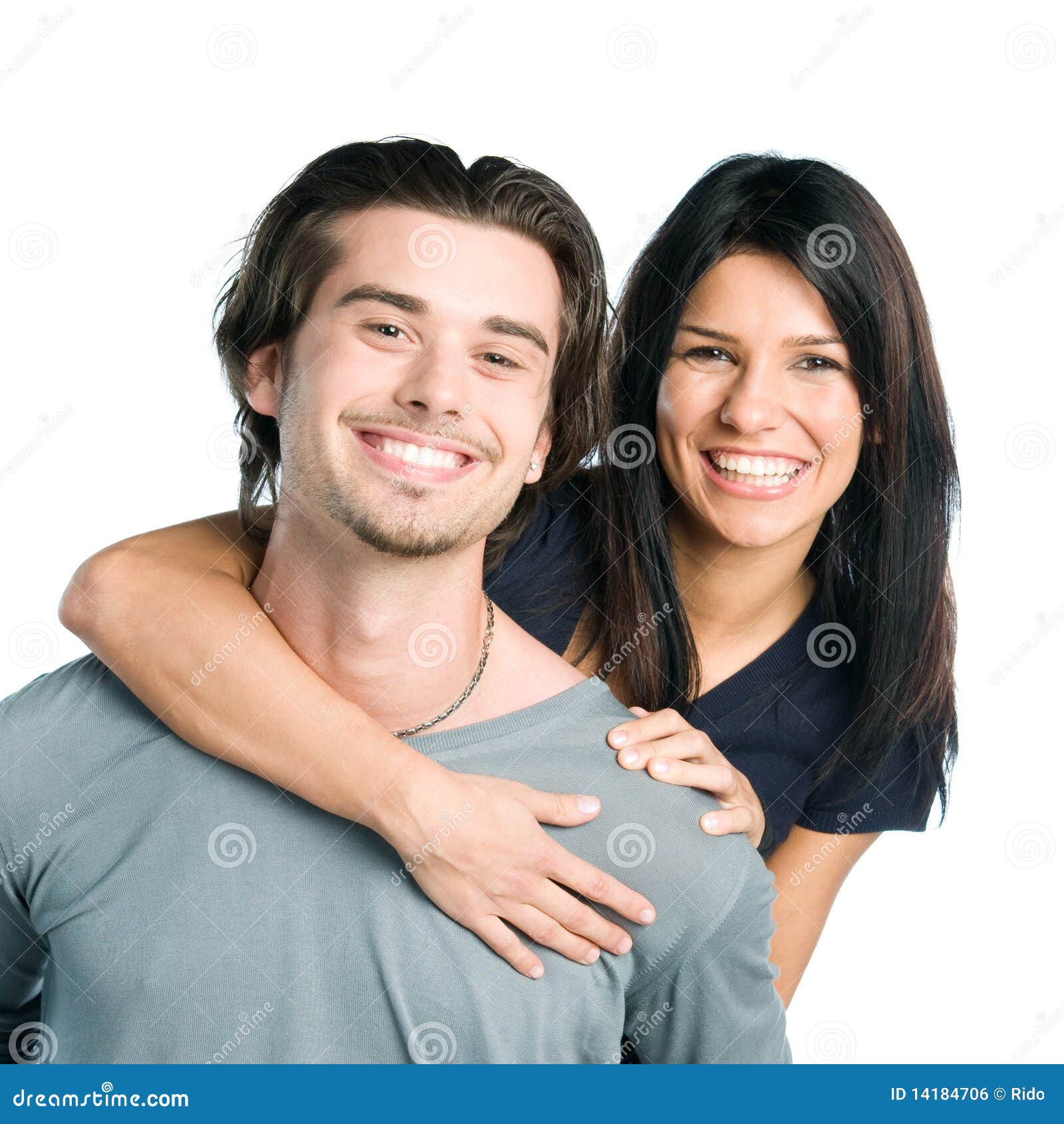 smiling young latin couple piggyback