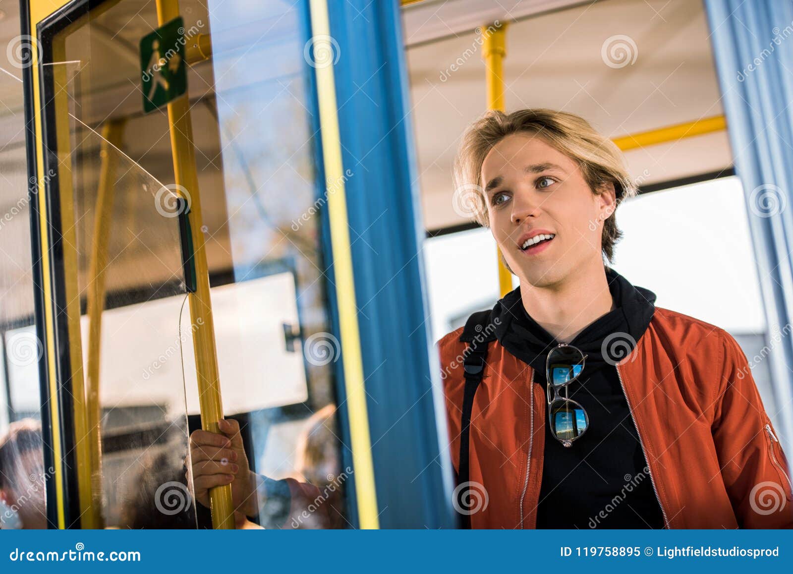 A Man is Sitting on the Bus Near a Glass Window with Steam Stock